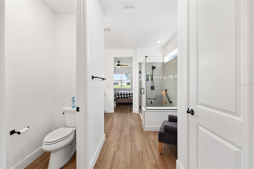 8989 Southwest 57th Pl Road Ocala, FL 34481 - Photo 26 of 47 a bathroom with a toilet and a shower