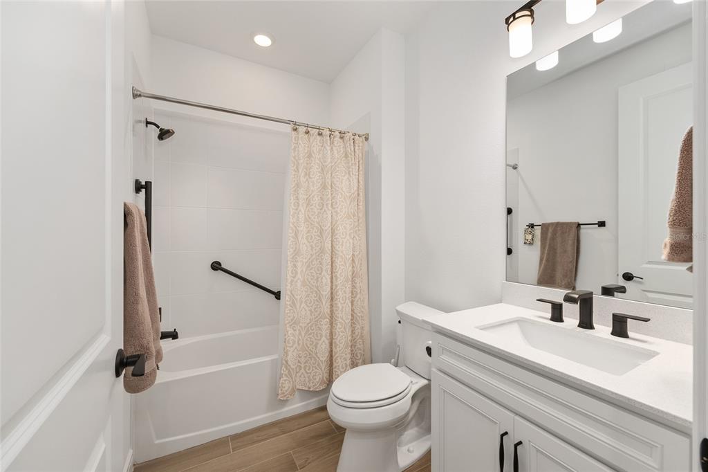 8989 Southwest 57th Pl Road Ocala, FL 34481 - Photo 30 of 47 a bathroom with a sink toilet and shower