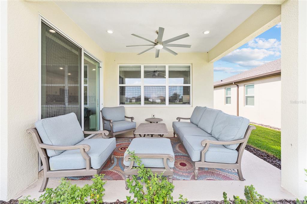 8989 Southwest 57th Pl Road Ocala, FL 34481 - Photo 39 of 47 a living room with furniture and a large window