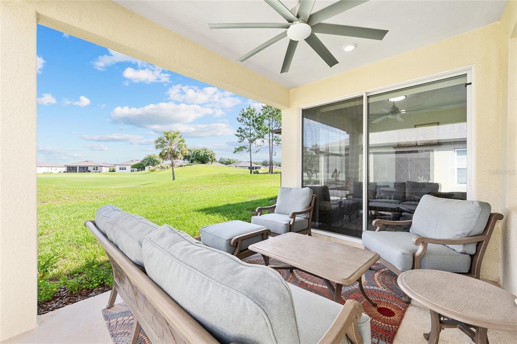8989 Southwest 57th Pl Road Ocala, FL 34481 - Photo 40 of 47 a backyard of a house with outdoor seating
