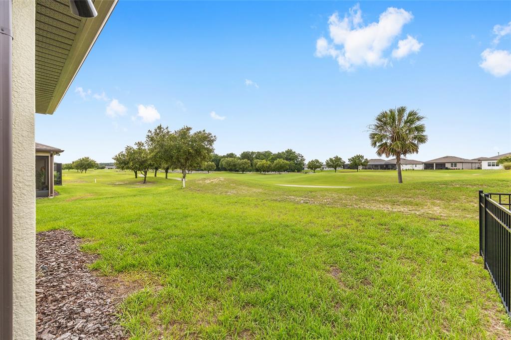 8989 Southwest 57th Pl Road Ocala, FL 34481 - Photo 43 of 47 a view of a big yard with an outdoor space