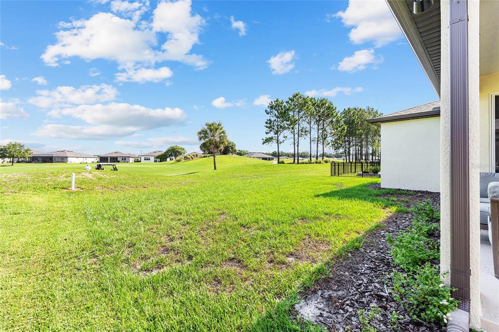 8989 Southwest 57th Pl Road Ocala, FL 34481 - Photo 44 of 47 a view of a golf course with an ocean