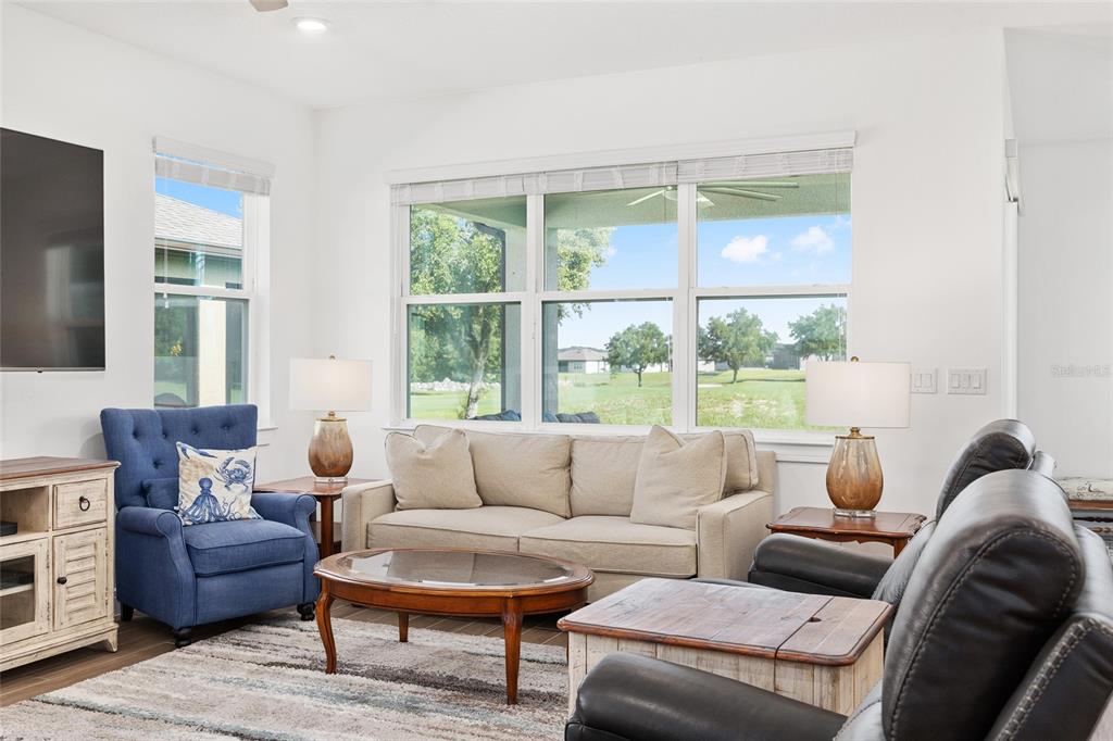 8989 Southwest 57th Pl Road Ocala, FL 34481 - Photo 7 of 47 a living room with furniture and a window