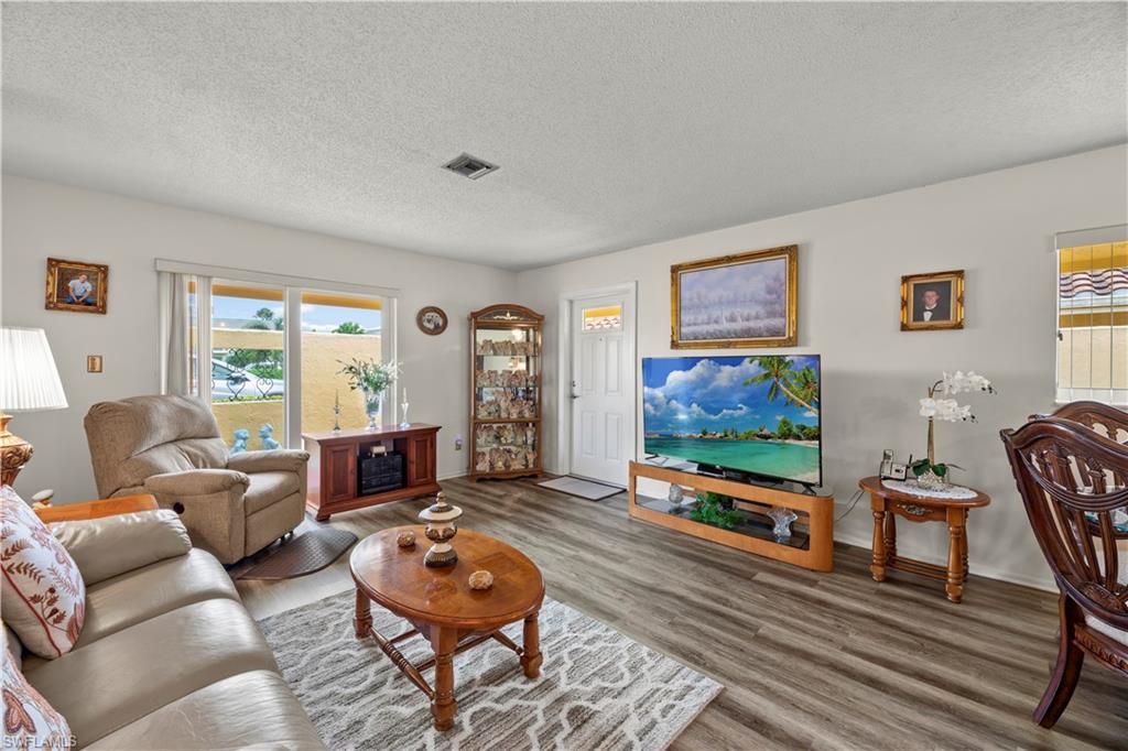 116 Harrison Road, Unit N3 Naples, FL 34112 - Photo 10 of 24 Living room with lots of natural light