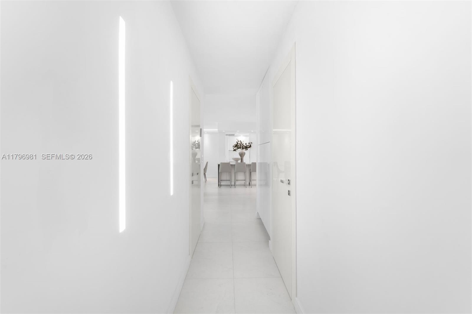 9801 Collins Avenue, Unit 17P Bal Harbour, FL 33154 - Photo 13 of 31 a view of a hallway with two couches and a coffee table