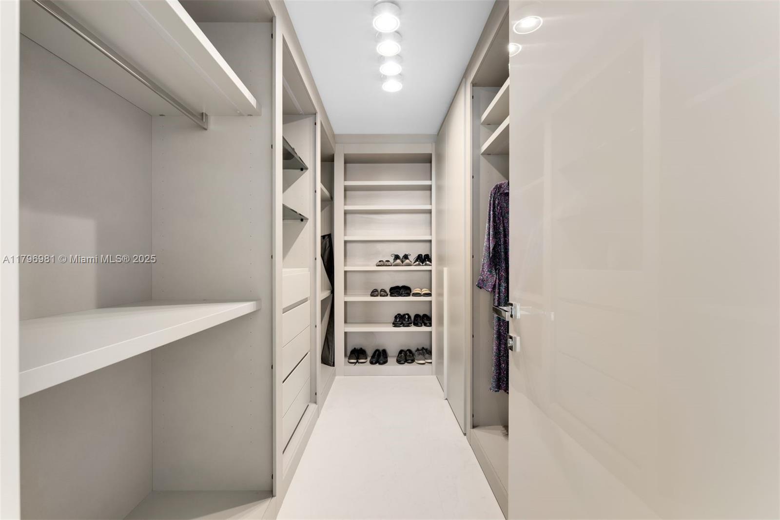 9801 Collins Avenue, Unit 17P Bal Harbour, FL 33154 - Photo 22 of 31 a view of walk in closet with empty racks