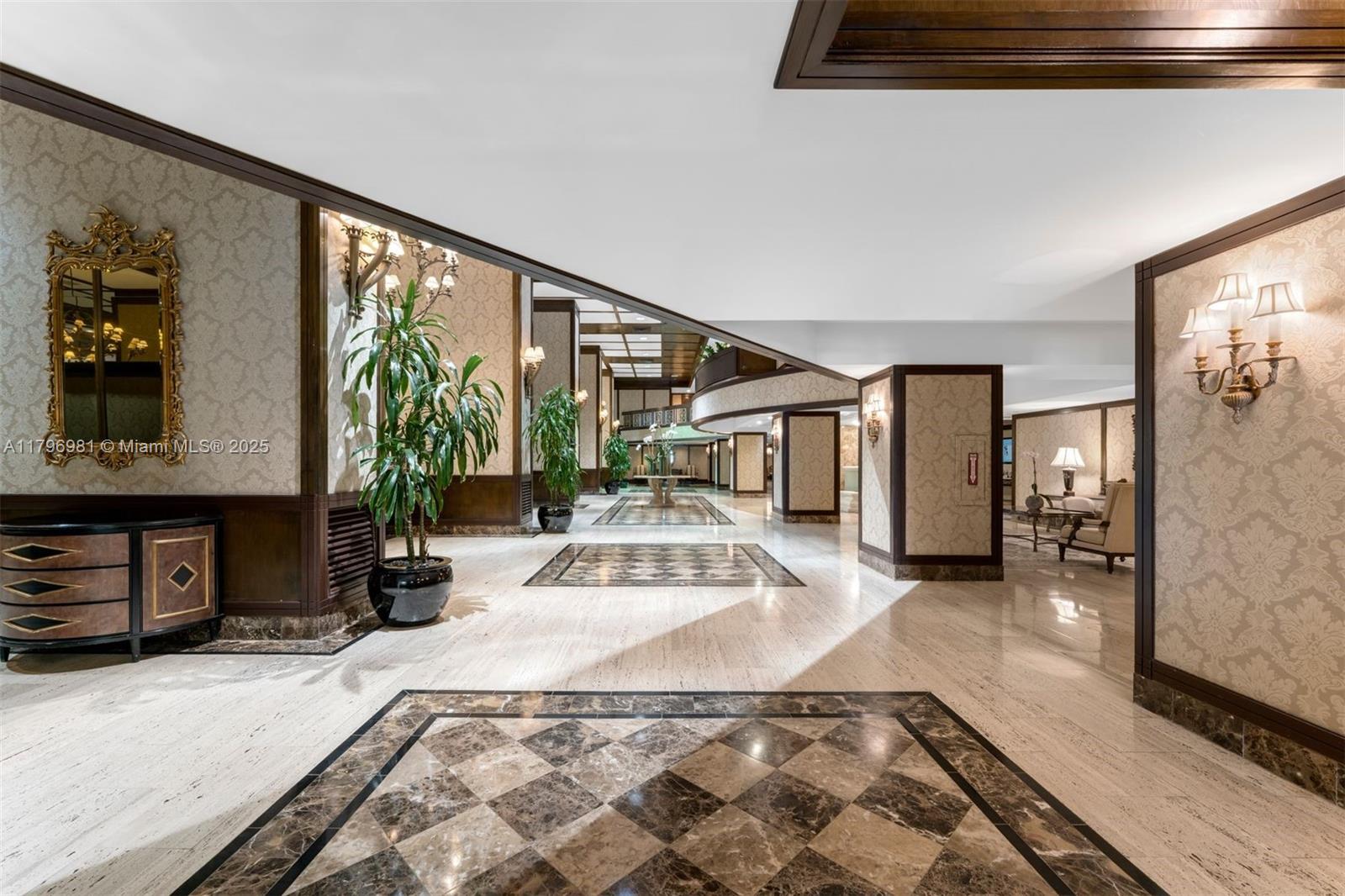 9801 Collins Avenue, Unit 17P Bal Harbour, FL 33154 - Photo 27 of 31 a view of a hallway with wooden floor and furniture