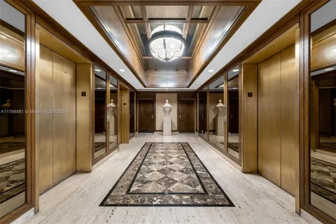 a living room with furniture and a book shelf