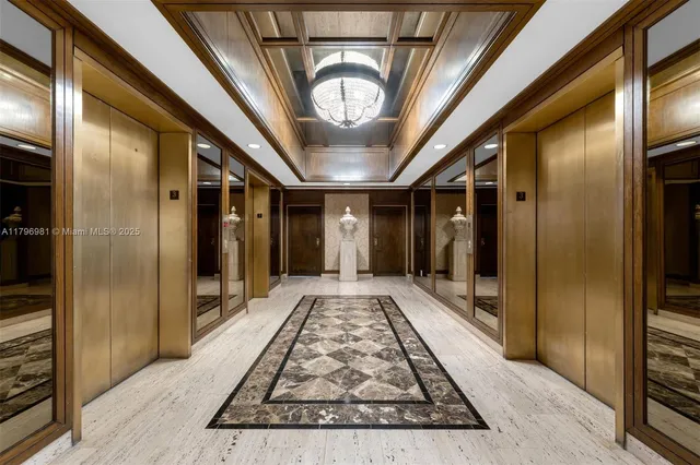 a living room with furniture and a book shelf