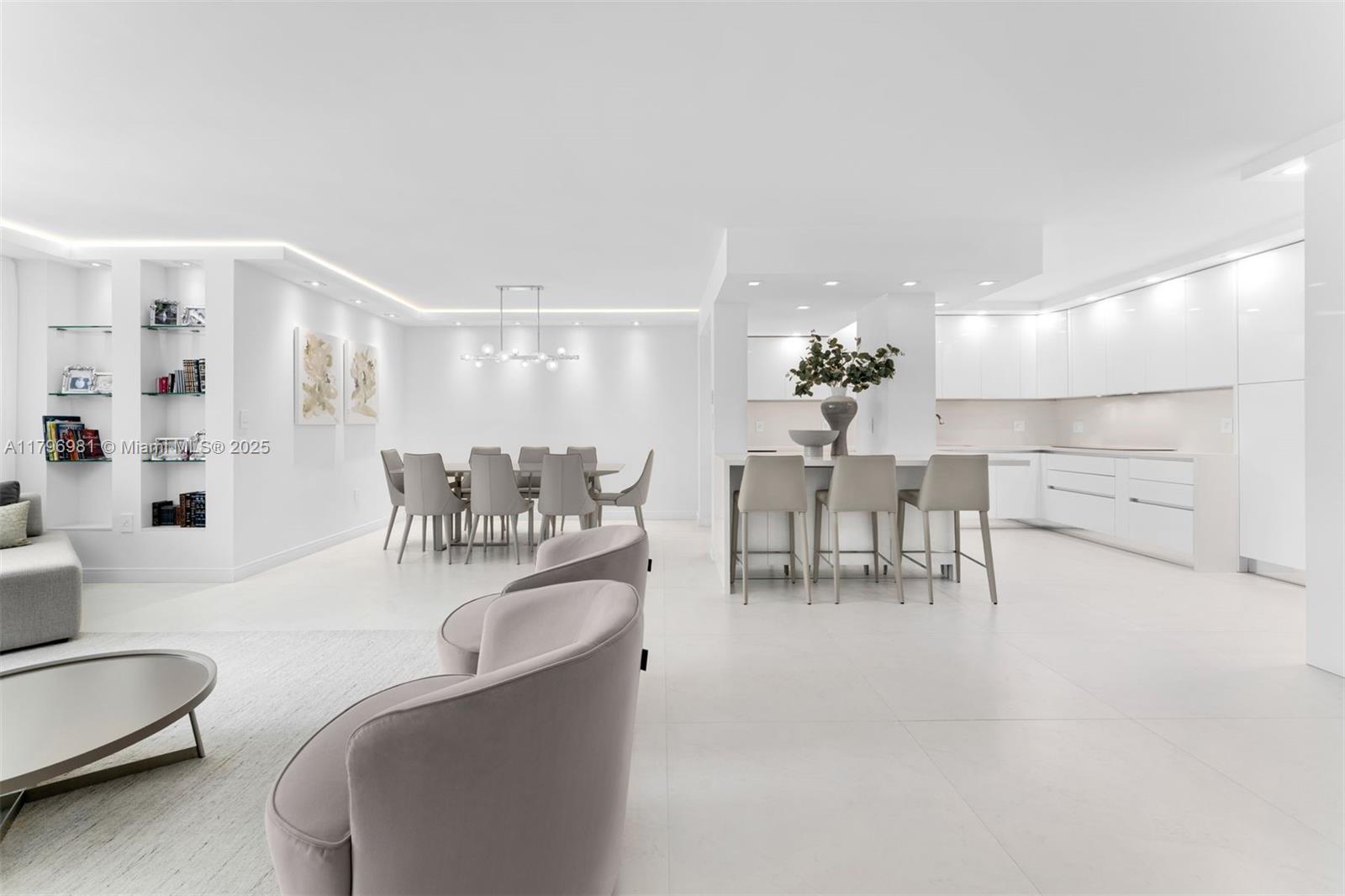 9801 Collins Avenue, Unit 17P Bal Harbour, FL 33154 - Photo 5 of 31 a dining room with furniture and a chandelier