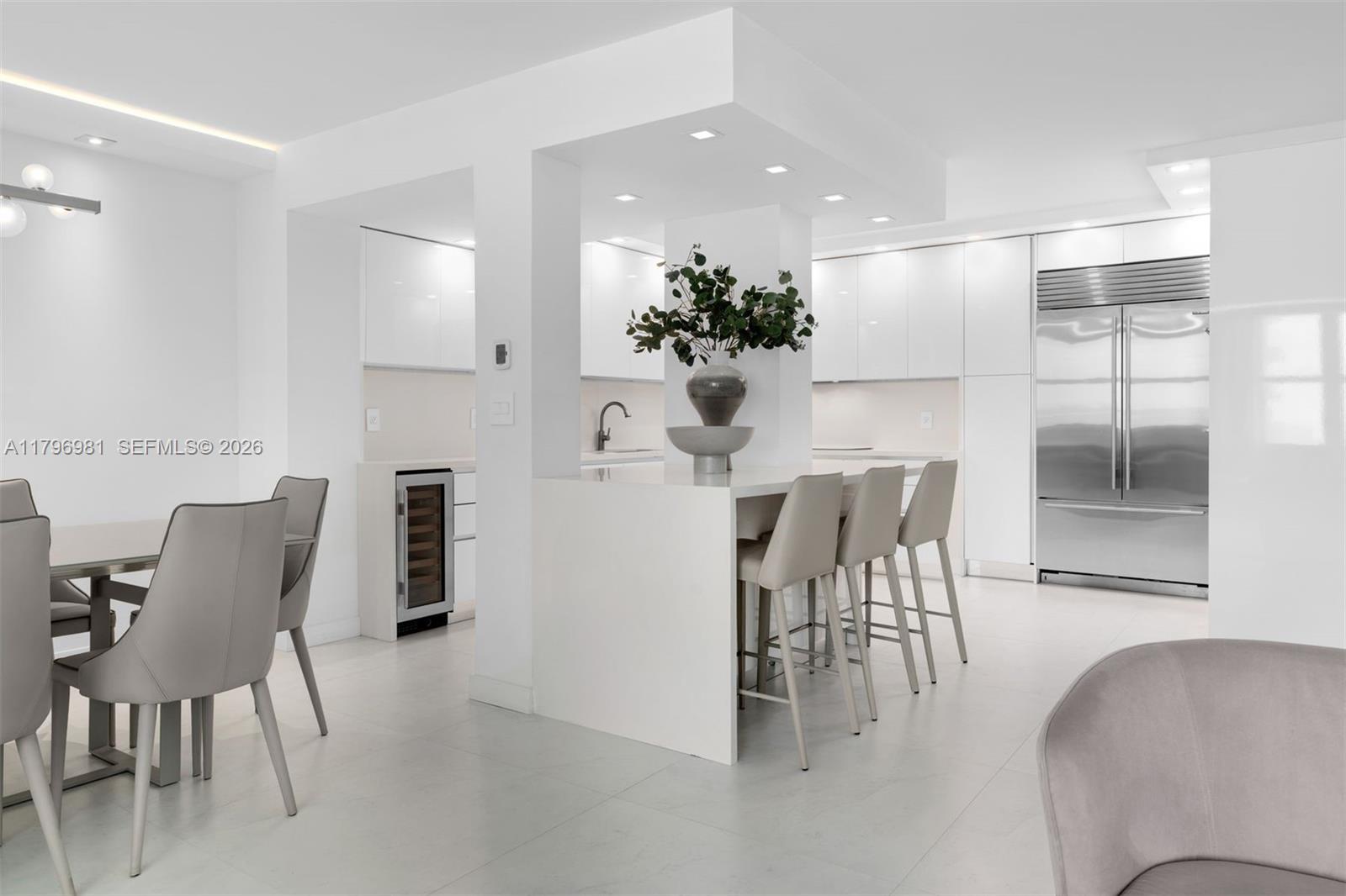 9801 Collins Avenue, Unit 17P Bal Harbour, FL 33154 - Photo 8 of 31 a dining room with furniture and wooden floor