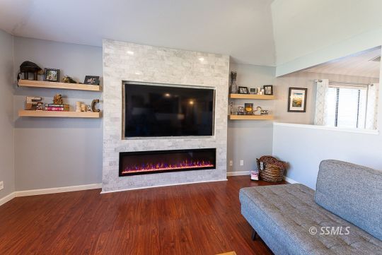 223 West Cobblestone Lane Ridgecrest, CA 93555 - Photo 9 of 34 a living room with furniture and a flat screen tv