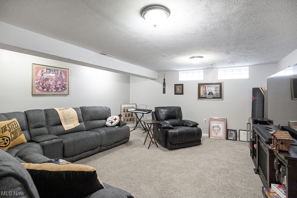 4242 Wyncote Road South Euclid, OH 44121 - Photo 20 of 22 Living room featuring light carpet and a textured ceiling