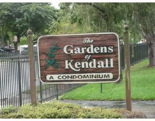 a view of outdoor space with a garden and signage
