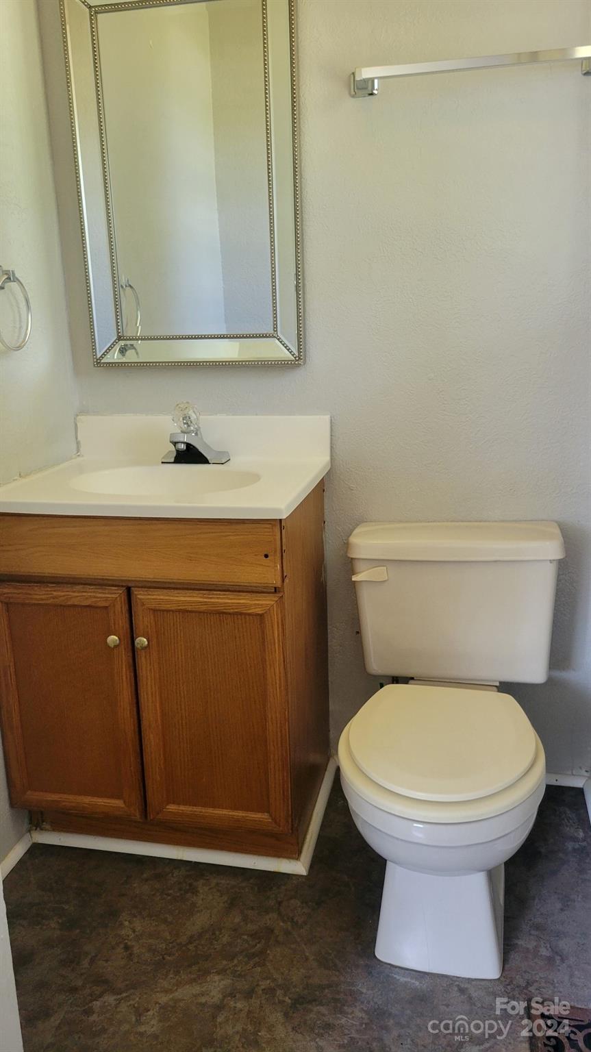 3401 Spencer Road Conover, NC 28613 - Photo 21 of 34 a bathroom with a toilet and a sink