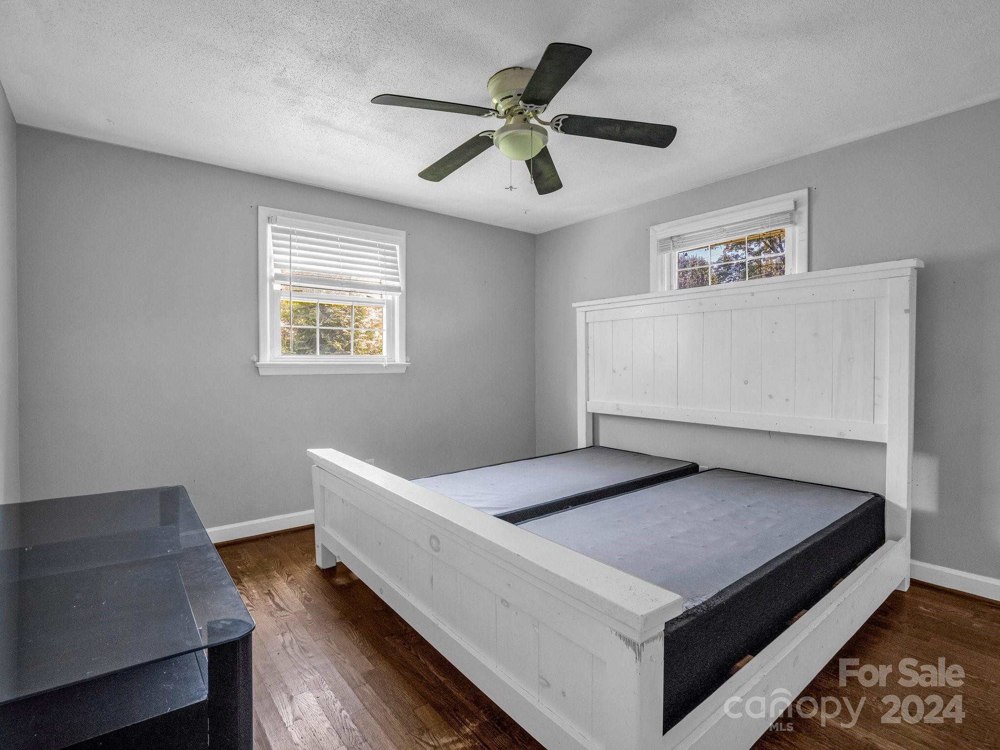 3401 Spencer Road Conover, NC 28613 - Photo 23 of 34 a living room with hard wood floor and a ceiling fan