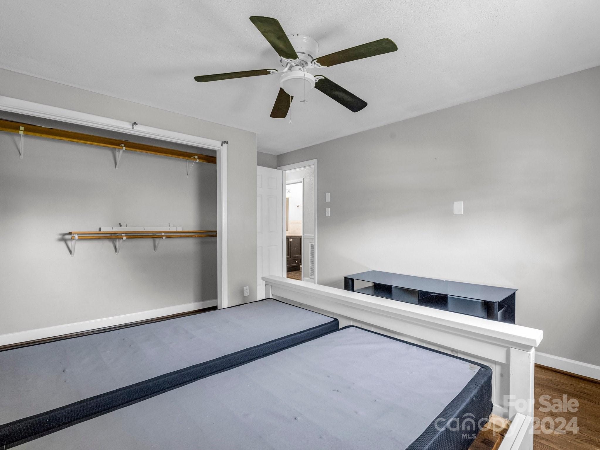 3401 Spencer Road Conover, NC 28613 - Photo 24 of 34 a bedroom with a bed and a ceiling fan
