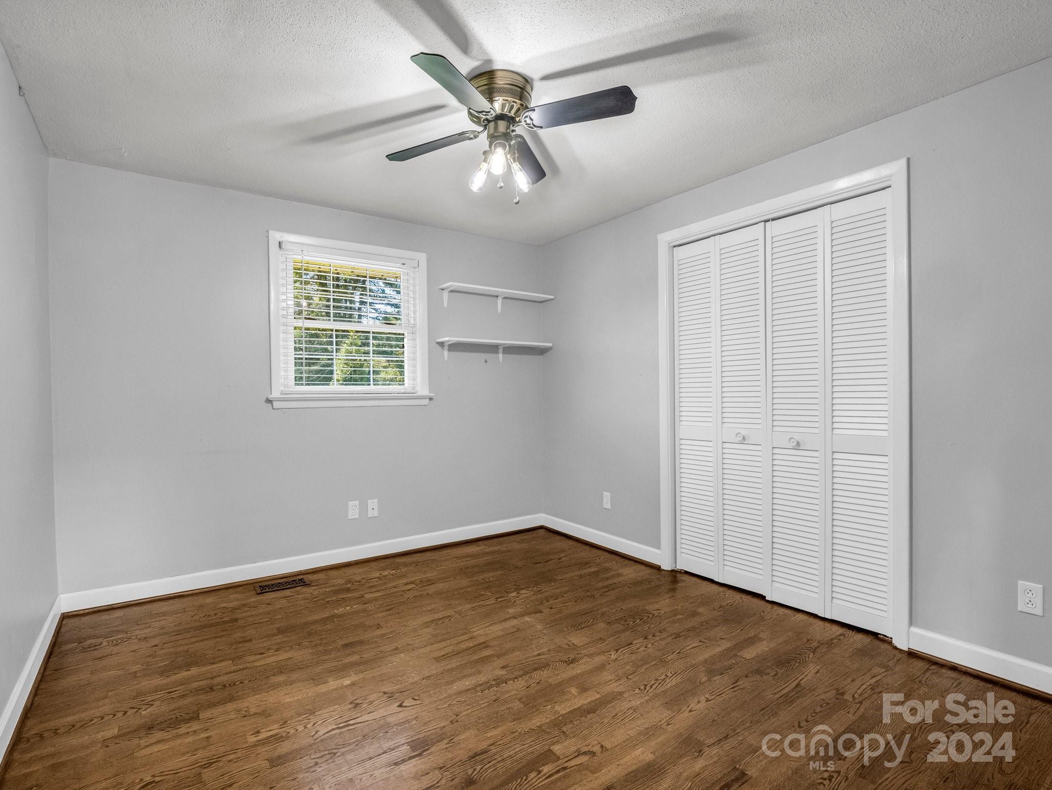 3401 Spencer Road Conover, NC 28613 - Photo 26 of 34 an empty room with fan and windows
