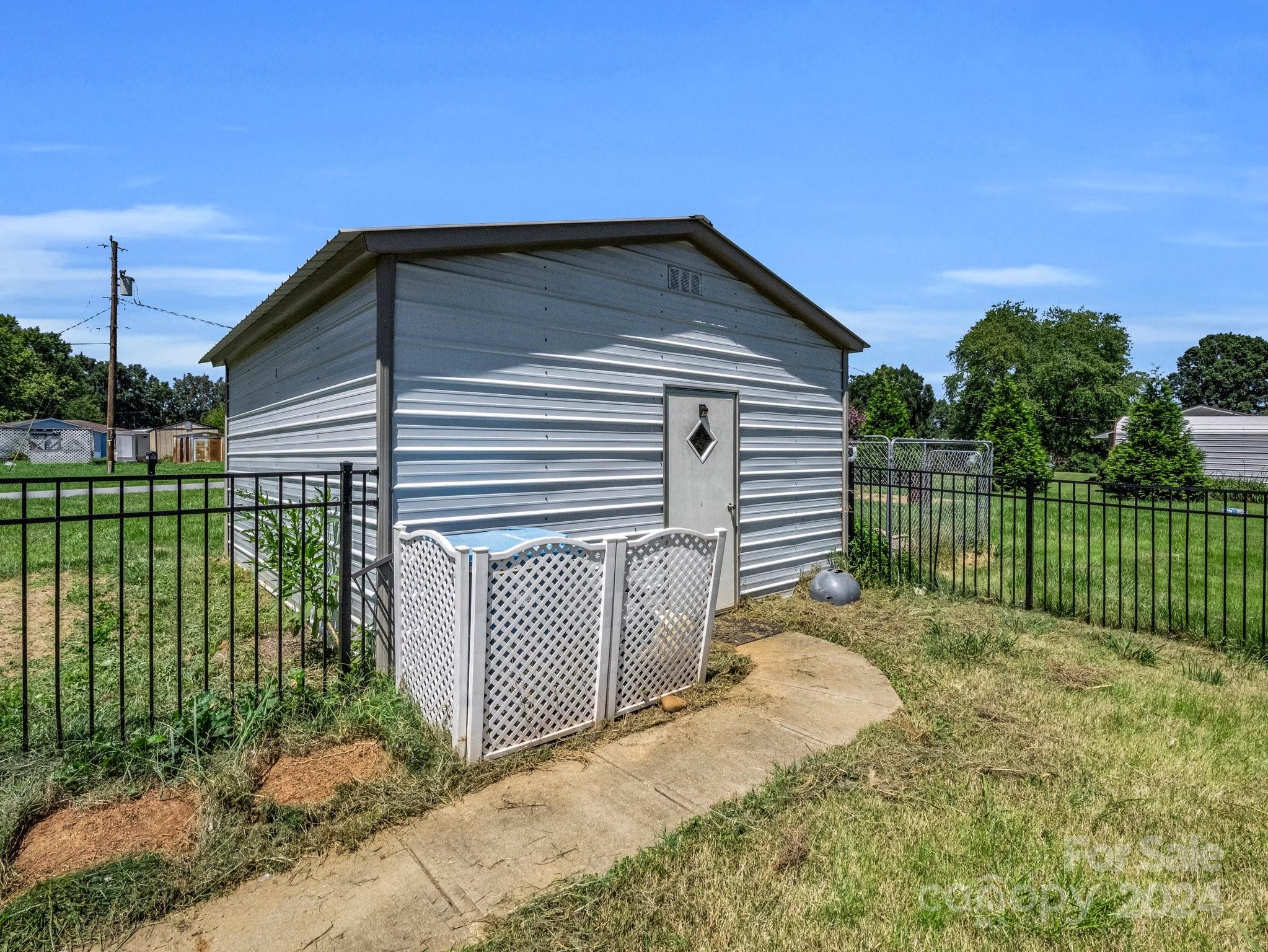 3401 Spencer Road Conover, NC 28613 - Photo 31 of 34 a view of a house with a wooden fence