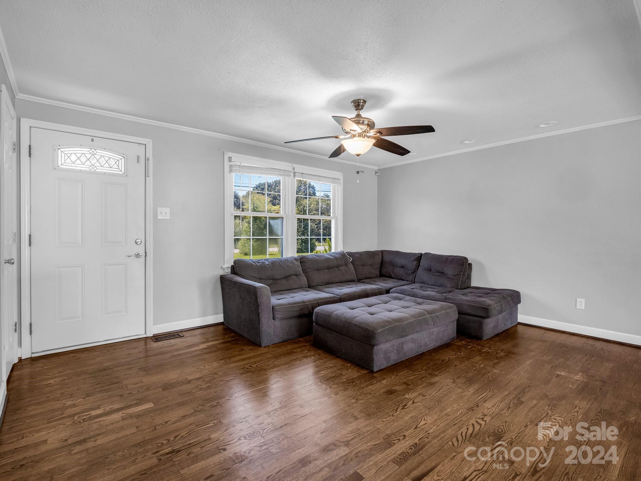 3401 Spencer Road Conover, NC 28613 - Photo 4 of 34 a living room with furniture and a ceiling fan