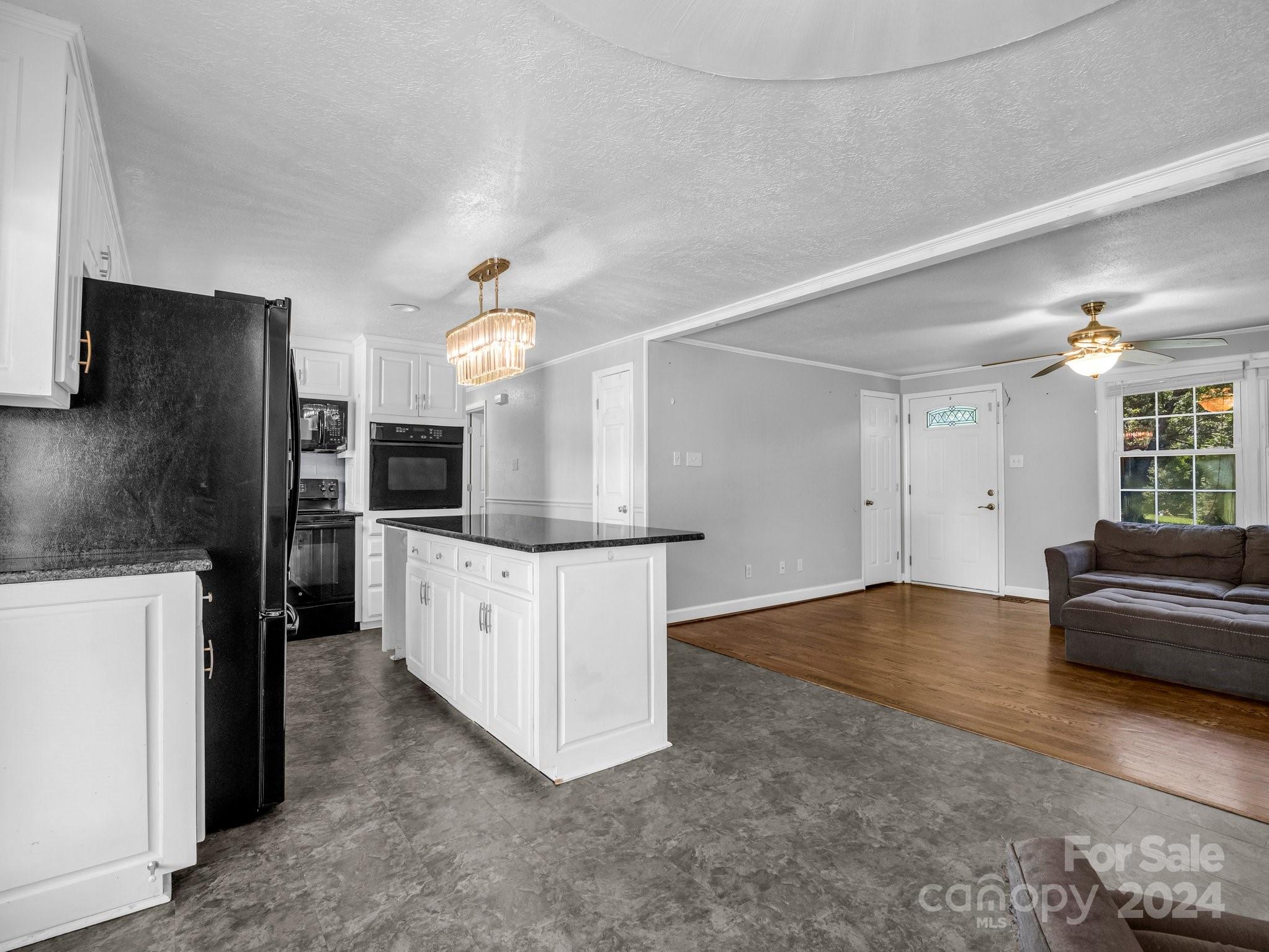 3401 Spencer Road Conover, NC 28613 - Photo 7 of 34 a kitchen with stainless steel appliances a refrigerator sink and stove