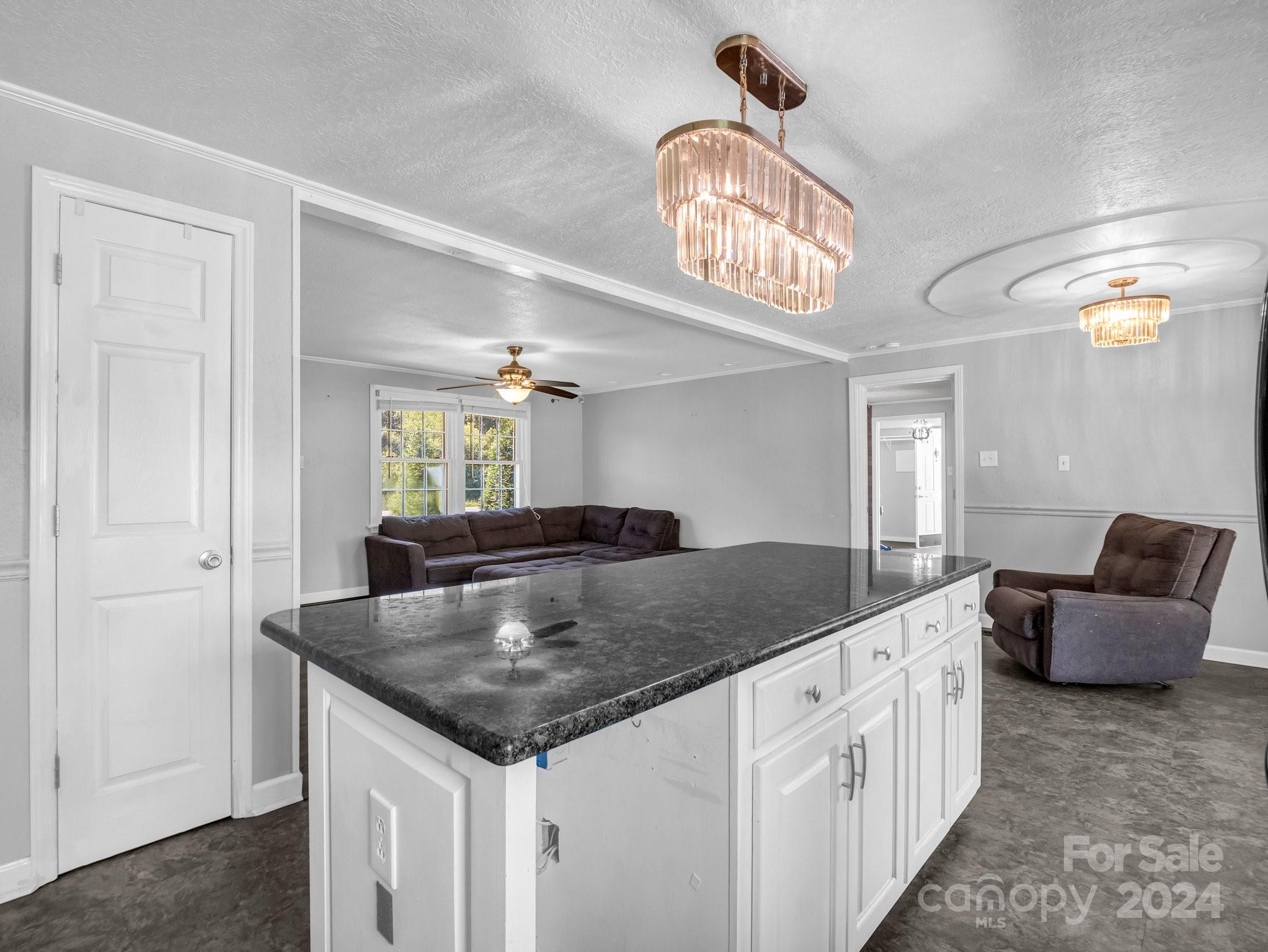 3401 Spencer Road Conover, NC 28613 - Photo 10 of 34 a kitchen with stainless steel appliances granite countertop a sink and a refrigerator