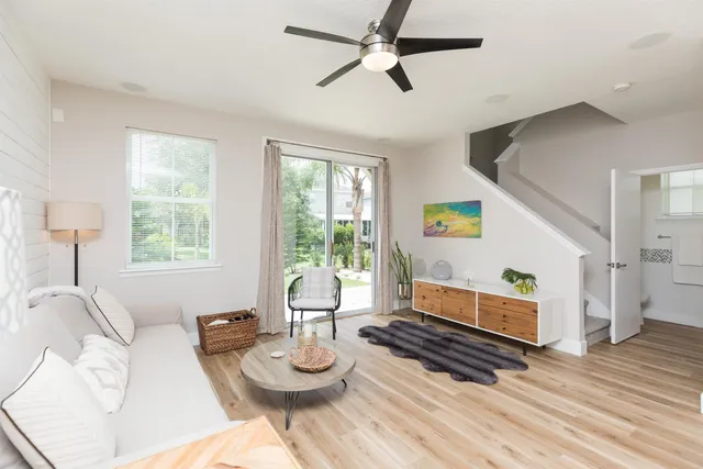 a living room with furniture and a window
