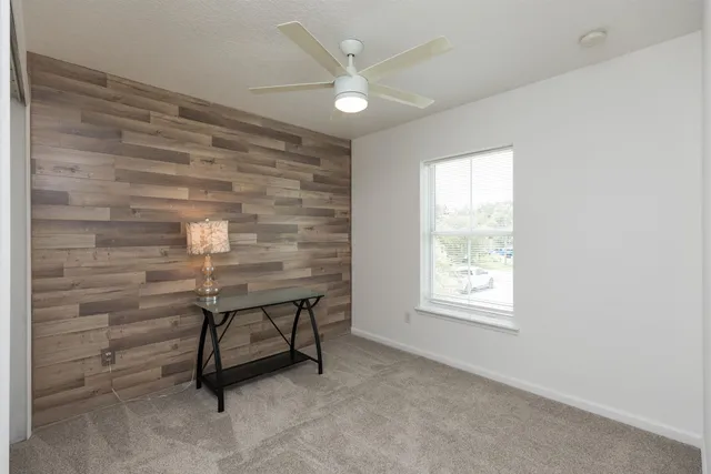 a bathroom with a bathtub shower sink vanity and toilet