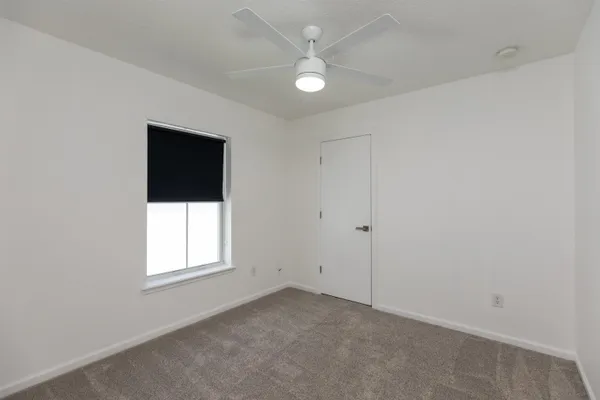 a view of a hallway with washer and dryer