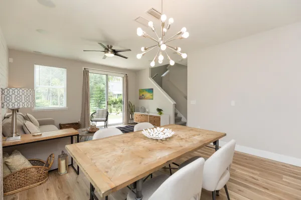 a view of a dining room with furniture window and outside view