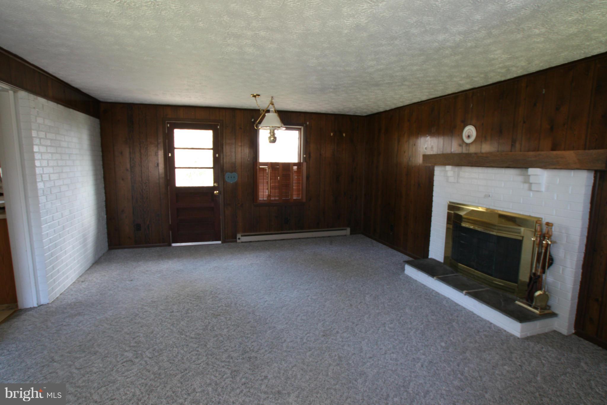 10611 Sweepstakes Road Damascus, MD 20872 - Photo 3 of 14 Family Room with wood burning fireplace