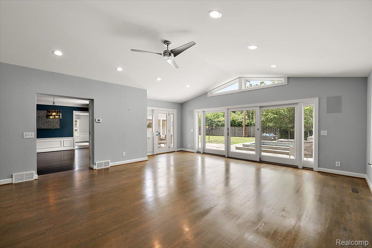 1051 Devonshire Road Grosse Pointe, MI 48230 - Photo 26 of 99 Spacious living area featuring wood-finish flooring, vaulted ceilings, and recessed lighting