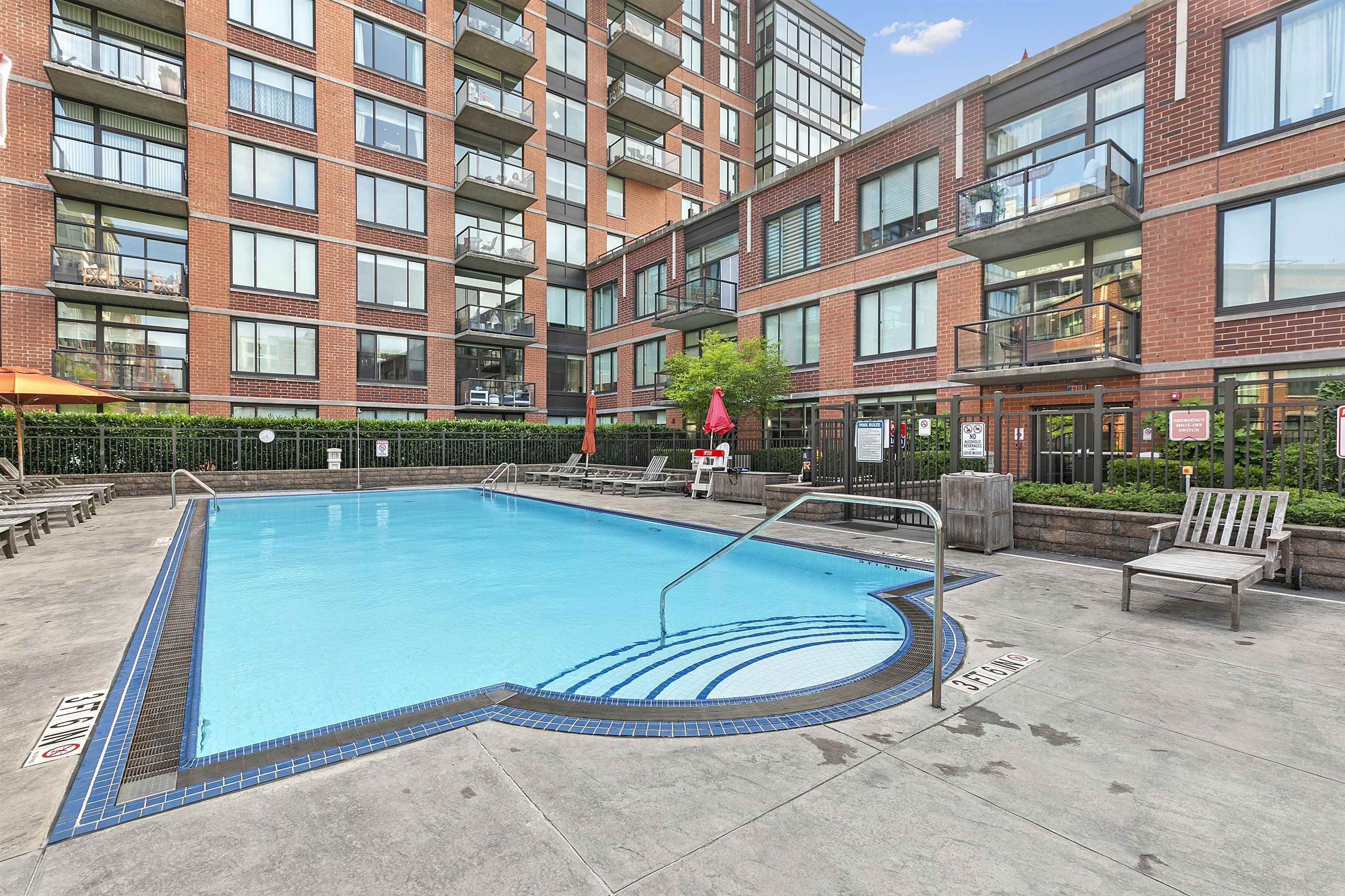 1100 Maxwell Lane, Unit 517 Hoboken, NJ 07030 - Photo 12 of 17 a view of a swimming pool with a patio