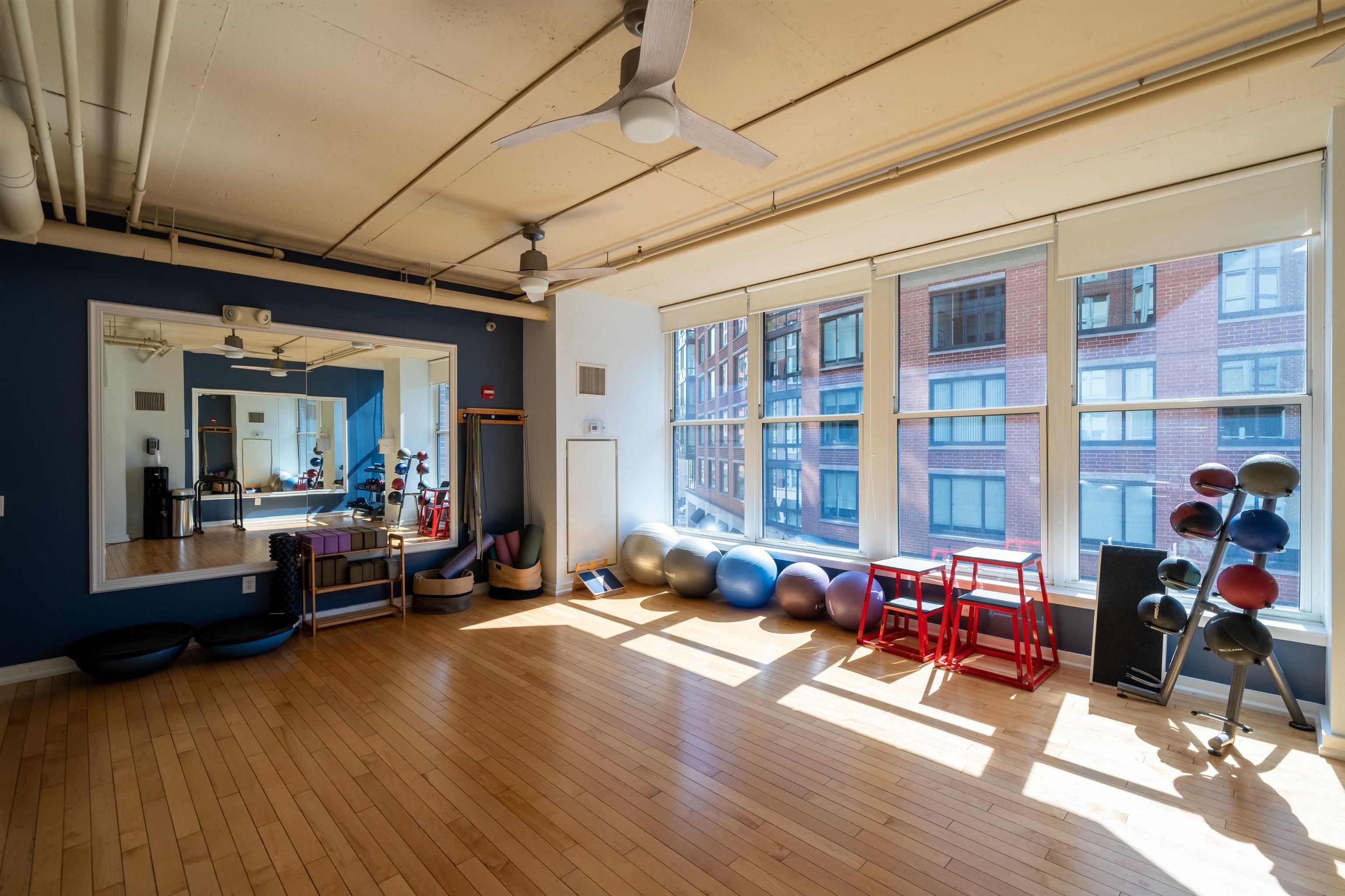 1100 Maxwell Lane, Unit 517 Hoboken, NJ 07030 - Photo 16 of 17 a living room with furniture window and wooden floor