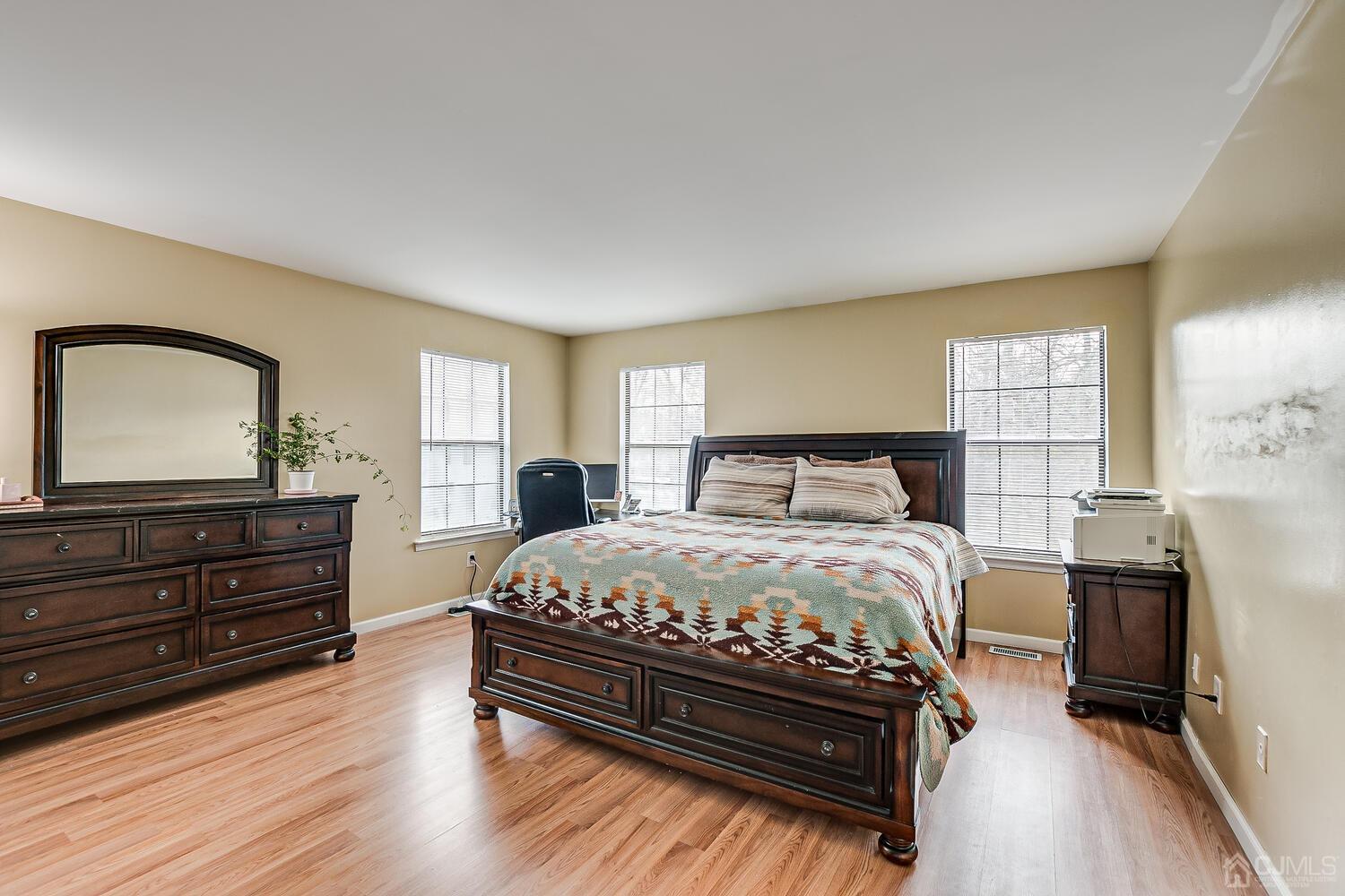 2701 Cricket Circle Edison, NJ 08820 - Photo 26 of 38 a bedroom with a bed and wooden floor