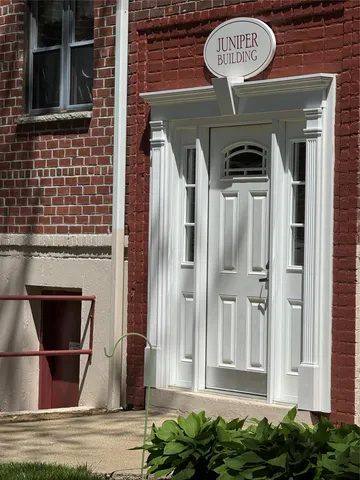 a front view of a building with a entryway