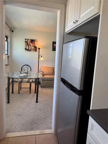 a kitchen with cabinets appliances and a sink