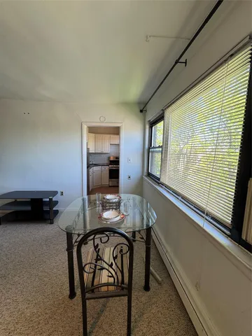 a bedroom with furniture and a wooden floor