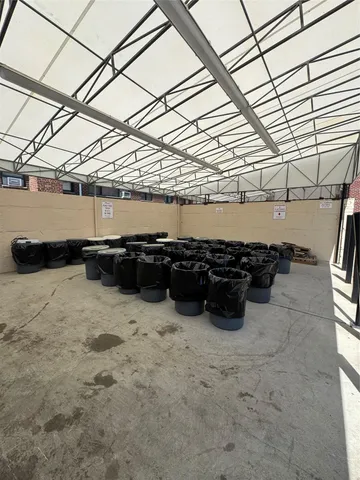 a view of swimming pool with sitting area