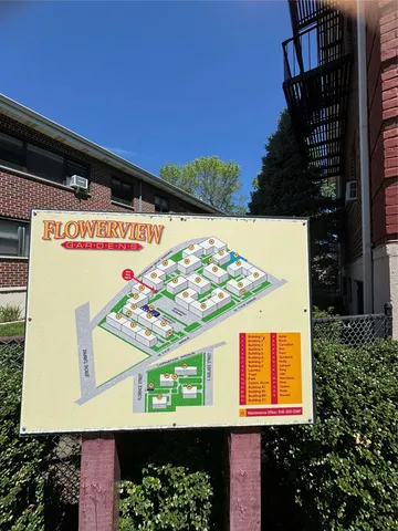 a view of a patio with plants and a lawn chairs