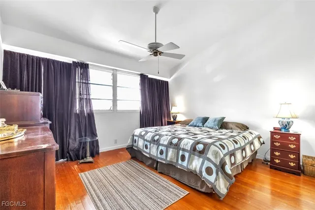 a bedroom with a bed dresser and a window