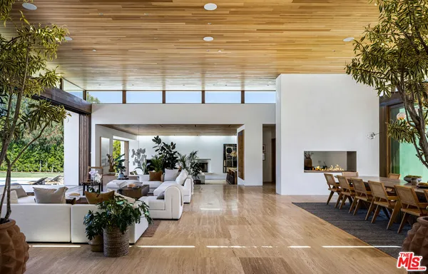 a kitchen with a table chairs stove and cabinets