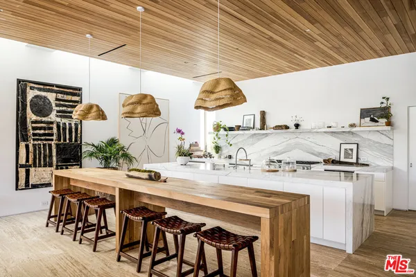 a kitchen with a table and chairs in it