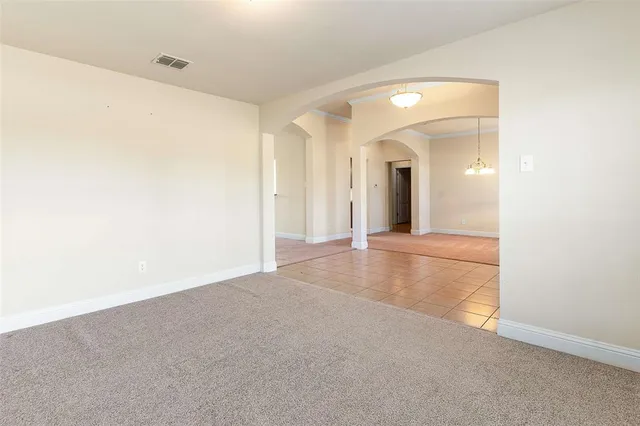 a view of a big room with closet and mirror