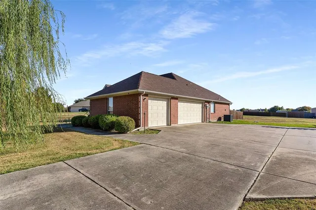 a house with trees in the background
