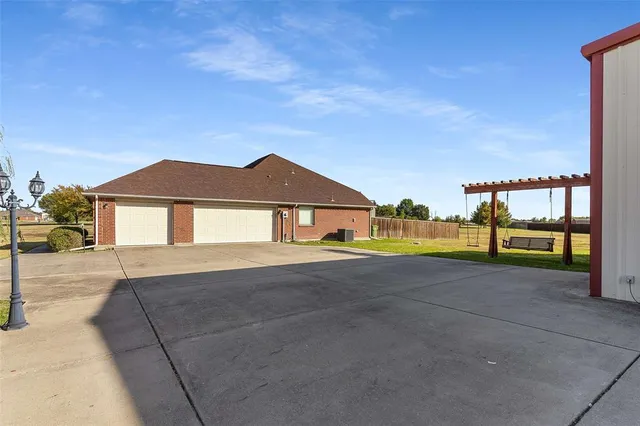 a view of house with a yard and a street view