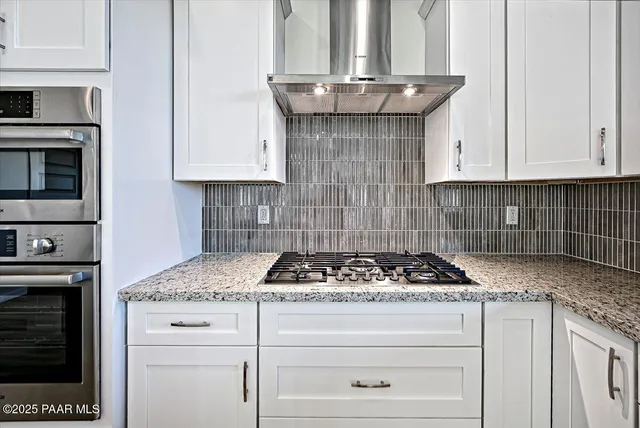 a view of a small space with wooden floor