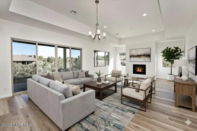 a kitchen with granite countertop white cabinets and stainless steel appliances