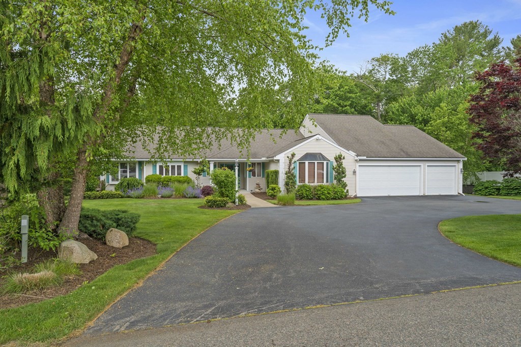 121 Setterland Farm Road Hanover, MA 02339 - Photo 1 of 33 a aerial view of a house next to a yard and large trees