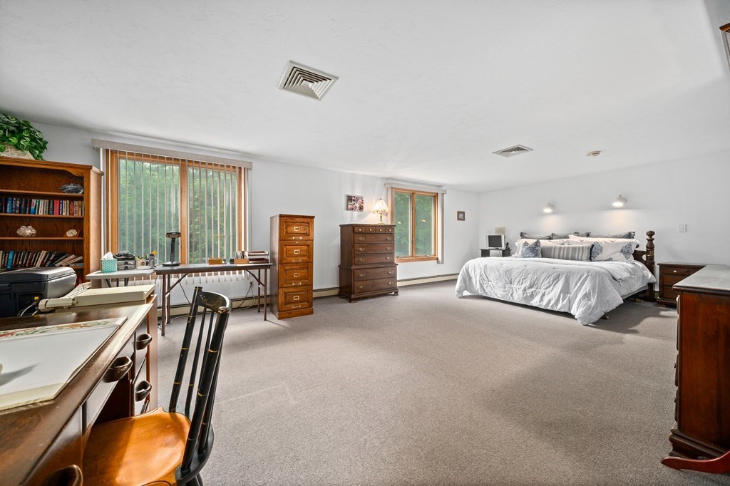 121 Setterland Farm Road Hanover, MA 02339 - Photo 12 of 33 a bedroom with furniture and a chair